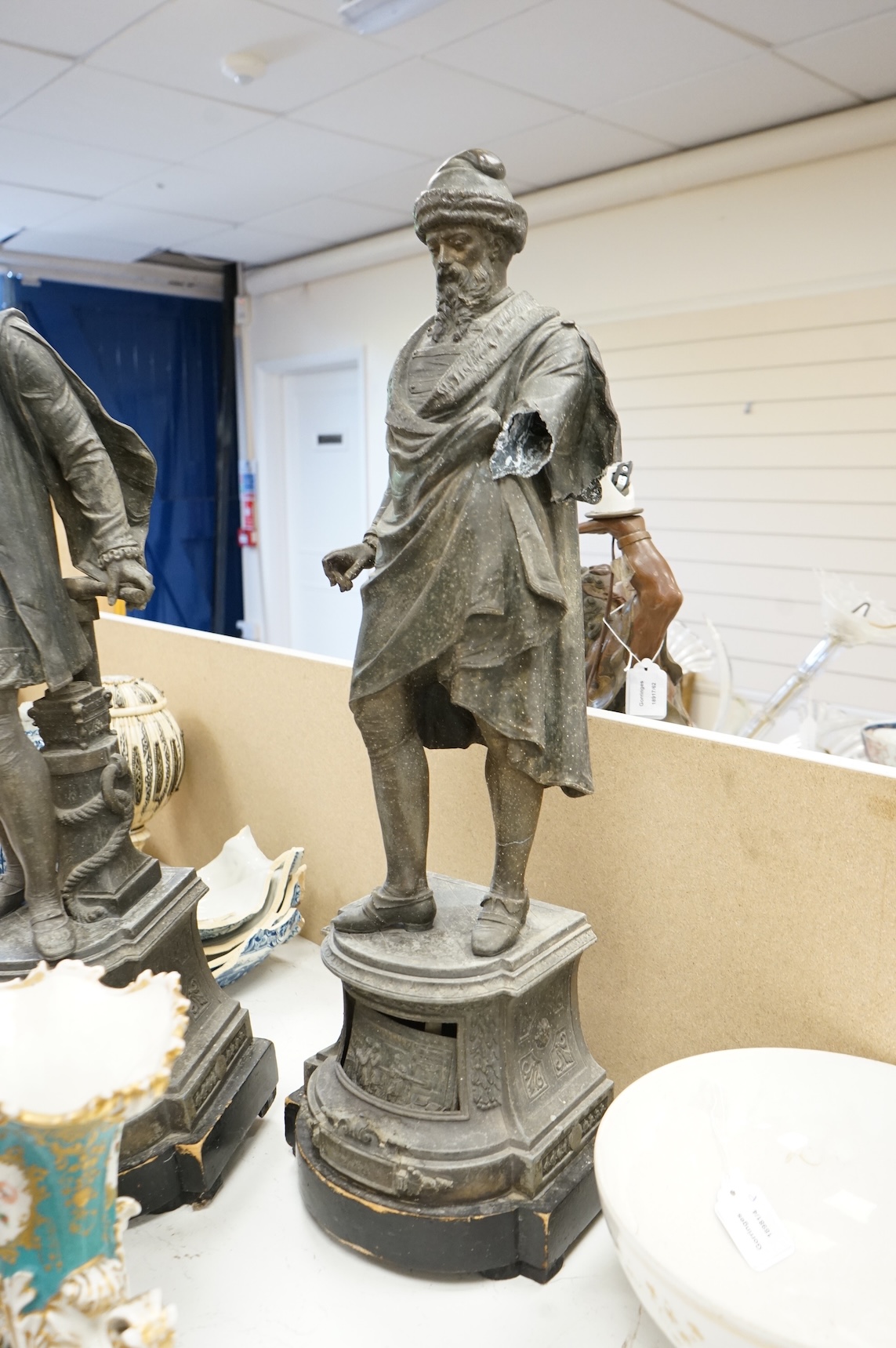 A pair of Victorian spelter figures of Columbus and Gutenberg, 73cm high (damaged)